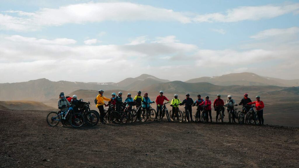 Riders with e-bike taking in panoramic views of Iceland's southern volcanic landscape in Hnausapollur