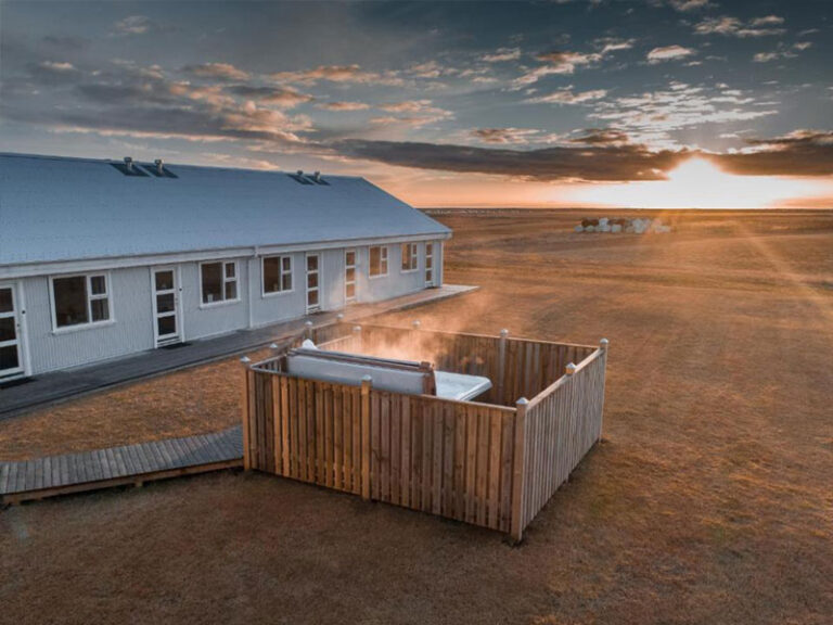 A view of the Vos Hotel at sunset with its hot tub